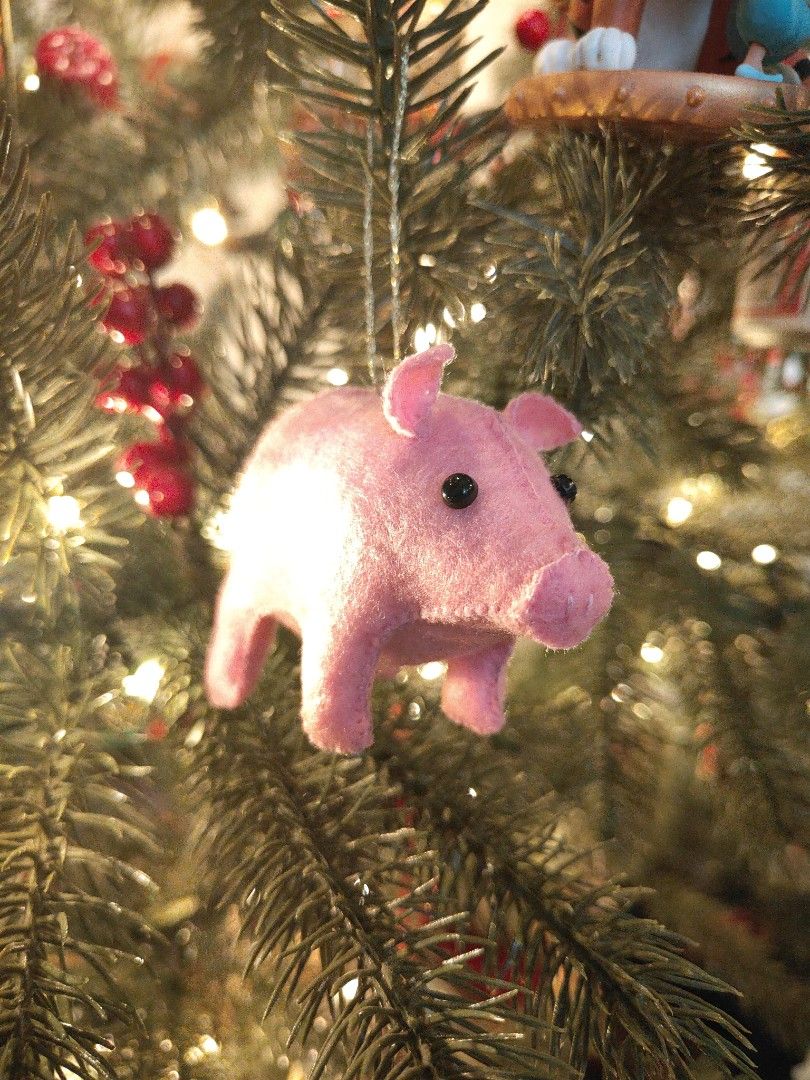 Pink Felt Pig Christmas Tree Ornament (Category: Handmade Craft) located in Mandaluyong City. Submitted by patchandpast (Listing ID 1465121663, Image 1). Description: - Handmade pink felt pig ornament - Soft fabric with stitched snout and dark bead eyes - Comes with a gold string loop for easy hanging - Adds a charming rustic farmhouse vibe to your Christmas tree.