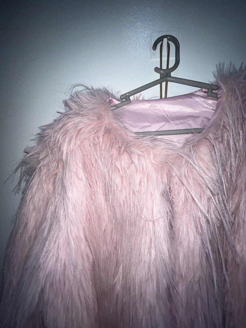 Pink fur fluffy cropped jacket coat (Category: Coats, Jackets and Outerwear) located in Mandaluyong City. Submitted by buddybuddy501 (Listing ID 1465043200, Image 2). Description: - Color: Soft baby pink - Material: Plush faux fur with smooth satin lining - Fit: Cropped length, long sleeves, collarless neckline - Style: Statement piece, ideal for parties and nights out - Condition: Clean and well-maintained.