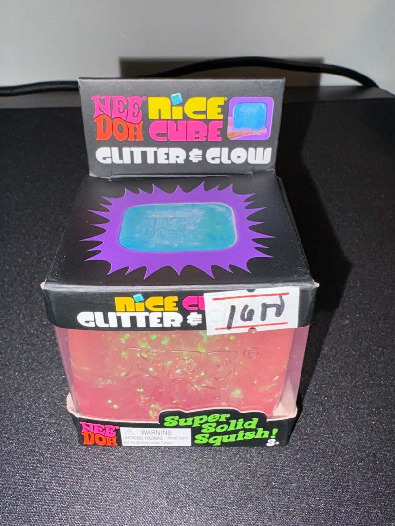 Pink NeeDoh Nice Cube Glitter and Glow (Category: Interactive Toys) located in Quezon City. Submitted by exndrd (Listing ID 1465003576, Image 1). Description: - Item: NeeDoh Nice Cube Fidget Toy - Color: Pink (Glitter & Glow version) - Texture: Super solid squish - Condition: Open packaging with original box included (as pictured) - Use: Great sensory toy and stress ball alternative.