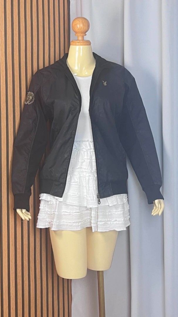 Playboy Black Bomber Jacket with Patch (Category: Coats, Jackets and Outerwear) located in Dumaguete. Submitted by morie_luna15 (Listing ID 1464978965, Image 1). Description: - Authentic black Playboy bomber jacket - Best fit for Small-Medium Only - Front zipper closure with a stand-up collar - Subtle all-over print body with solid black sleeves and ribbed cuffs - Embroidered Playboy rabbit head logo on the chest - Stylish '53 crest patch on the 