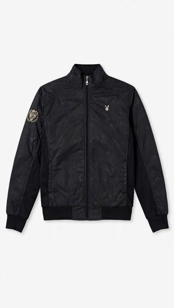 Playboy Black Bomber Jacket with Patch (Category: Coats, Jackets and Outerwear) located in Dumaguete. Submitted by morie_luna15 (Listing ID 1464978965, Image 3). Description: - Authentic black Playboy bomber jacket - Best fit for Small-Medium Only - Front zipper closure with a stand-up collar - Subtle all-over print body with solid black sleeves and ribbed cuffs - Embroidered Playboy rabbit head logo on the chest - Stylish '53 crest patch on the 