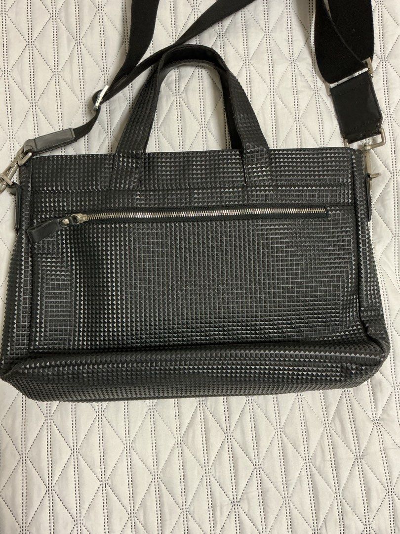 POLICE Laptop Briefcase Bag (Category: Briefcases) located in Makati City. Submitted by boldturtle-8720 (Listing ID 1465130549, Image 3). Description: Black Police Borsa Pyramid Bag featuring a textured geometric pyramid pattern, dual carry handles, and an adjustable shoulder strap 17” x 11” x 3”.