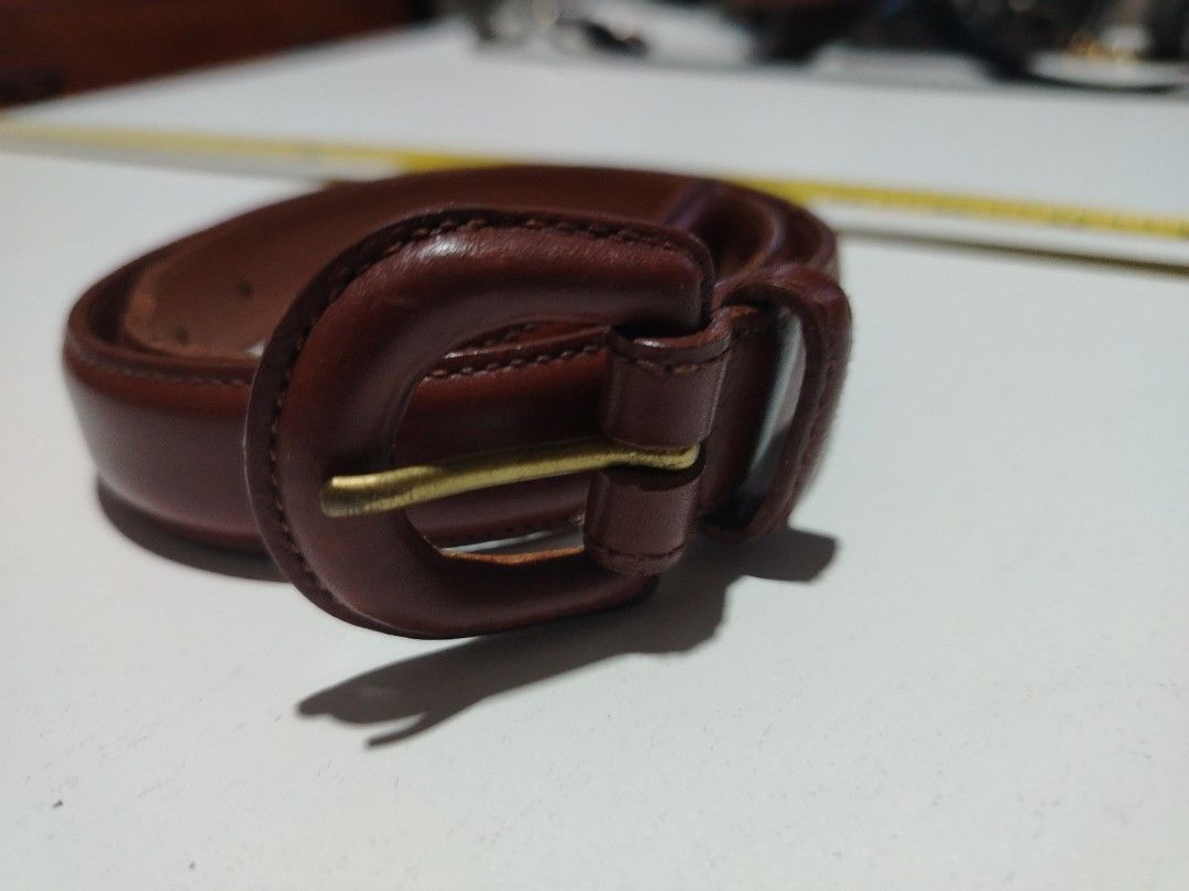 Polo ralph lauren leather belt (Category: Luxury Apparel) located in Manila. Submitted by rockandrolly (Listing ID 1465106330, Image 1). Description: ✅ Brand: Polo Ralph Lauren 🇺🇸 — embossed logo & Pony emblem ✅ Material: Premium tan/brown full-grain leather — leather-covered buckle with brass pin ✅ Size: 26" / 65cm — fits waist 24"–26" ✅ Condition: Pre-owned — lovely natural patina, solid leather, no tears or damage ✅ Versatile classic design 