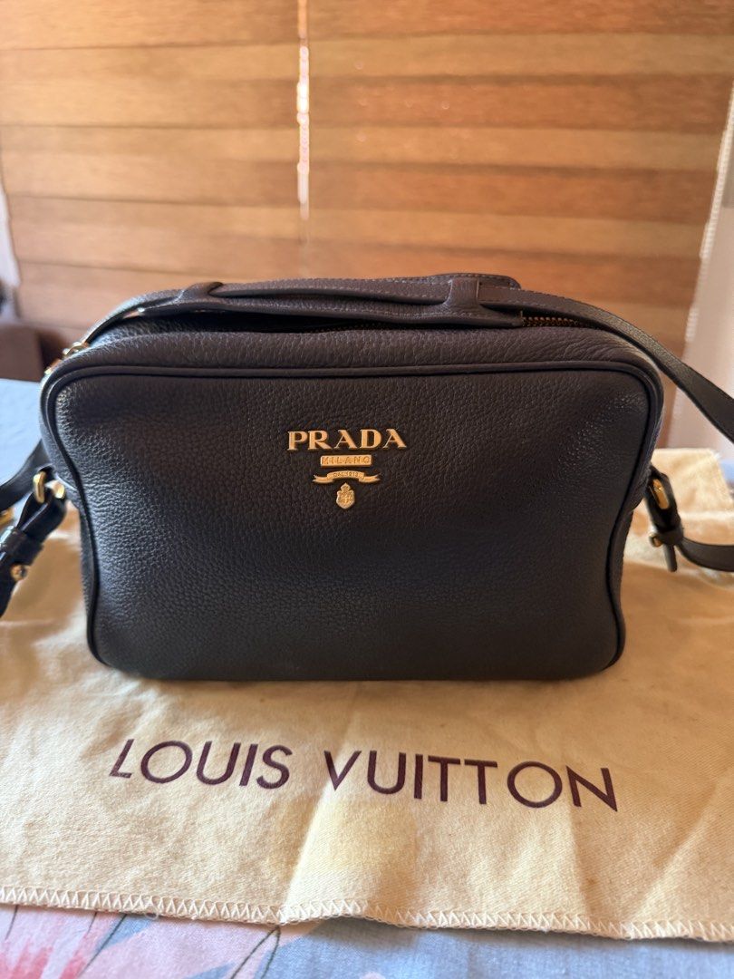 PRADA CAMERA BAG (Category: Luxury Bags & Wallets) located in Candaba. Submitted by juanitades (Listing ID 1465008787, Image 2). Description: 💯 Guaranteed Original Prada camera crossbody bag Preloved in excellent condition gold hardwares black spacious,can fit long wallet Bag only Pm if interested 💌.