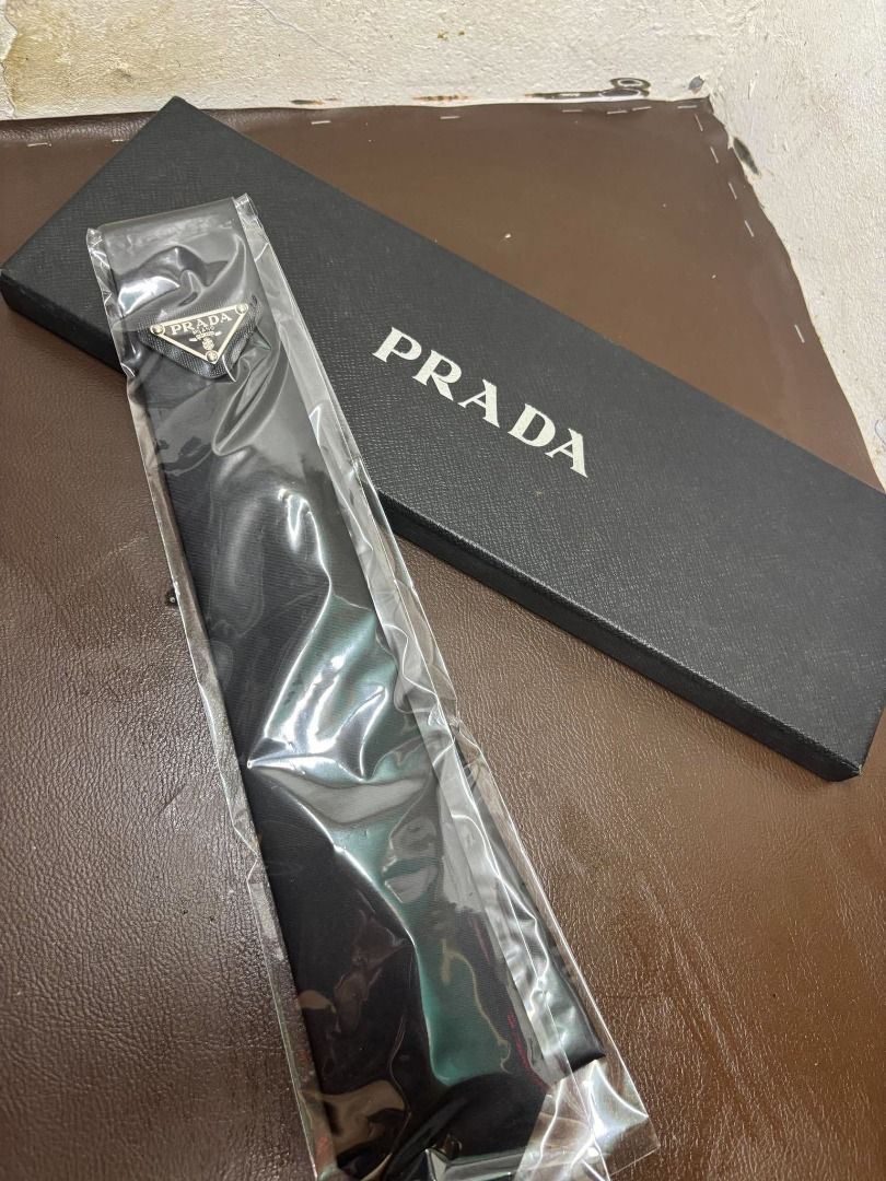 Prada Re-Nylon Gabardine Tie | Black | Complete Set (Category: Ties) located in Bacoor. Submitted by fafofa (Listing ID 1465104162, Image 2). Description: Prada Re-Nylon Gabardine Tie in black, featuring the iconic enameled metal Prada triangle logo. • Prada Re-Nylon Gabardine • Black • Enameled metal triangle logo • Complete set • Includes original box • Includes tags.