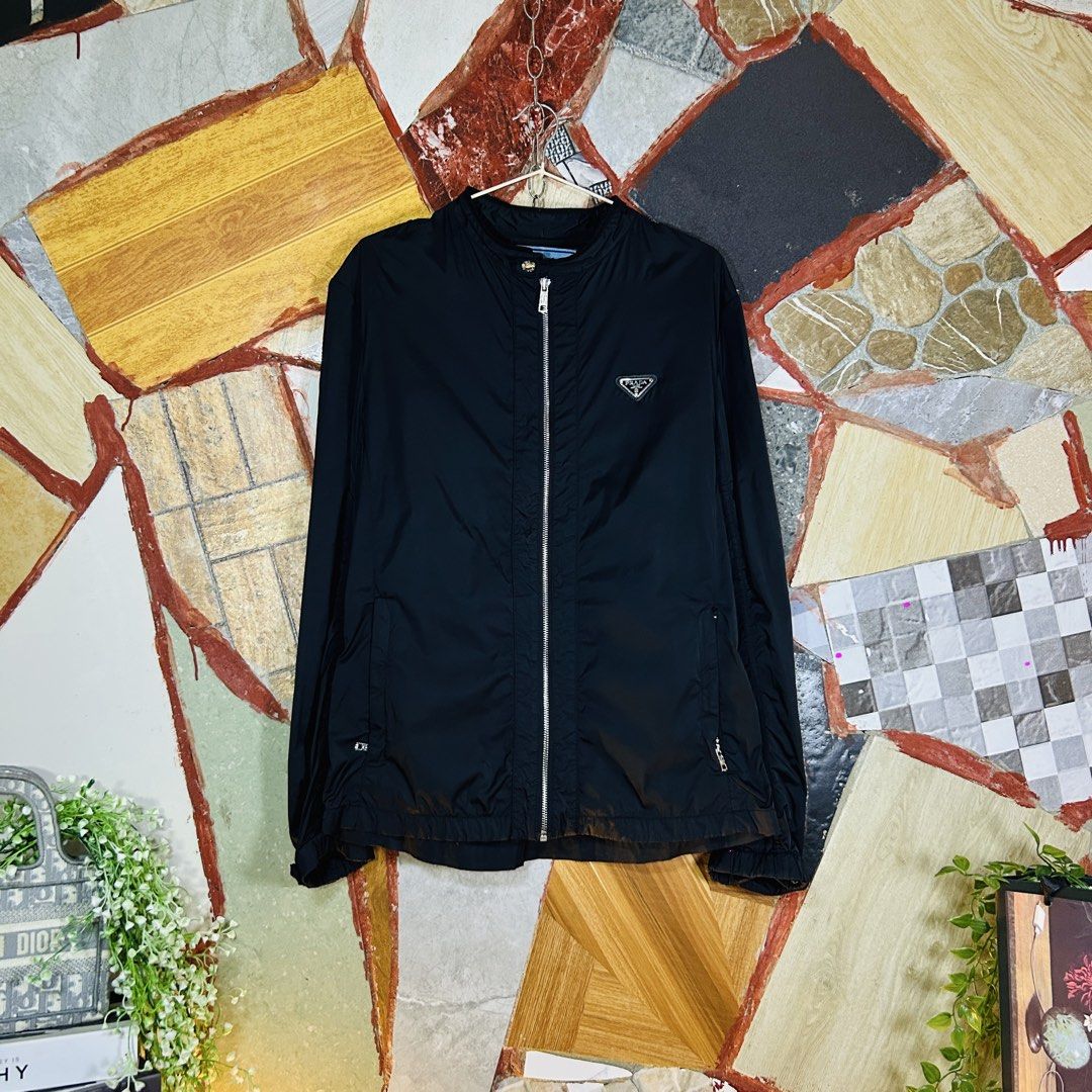 Prada windbreaker lightweight jacket (Category: Luxury Apparel) located in Baguio. Submitted by kckc_luxury (Listing ID 1465108094, Image 1). Description: 🌸 TINY PINK SPOTS ARE LENS DAMAGE, NOT CLOTH STAINS ————————— ❗️KINDLY READ BEFORE MAKING AN OFFER❗️ LISTING DETAILS size:M width x length (inches):21x28 condition: EXCELLENT --- MOP: Gcash / BPI MOD: J&T / JRS LOCATION: Baguio City --- NOTE: • Manage your expectations • Photos did not go unde