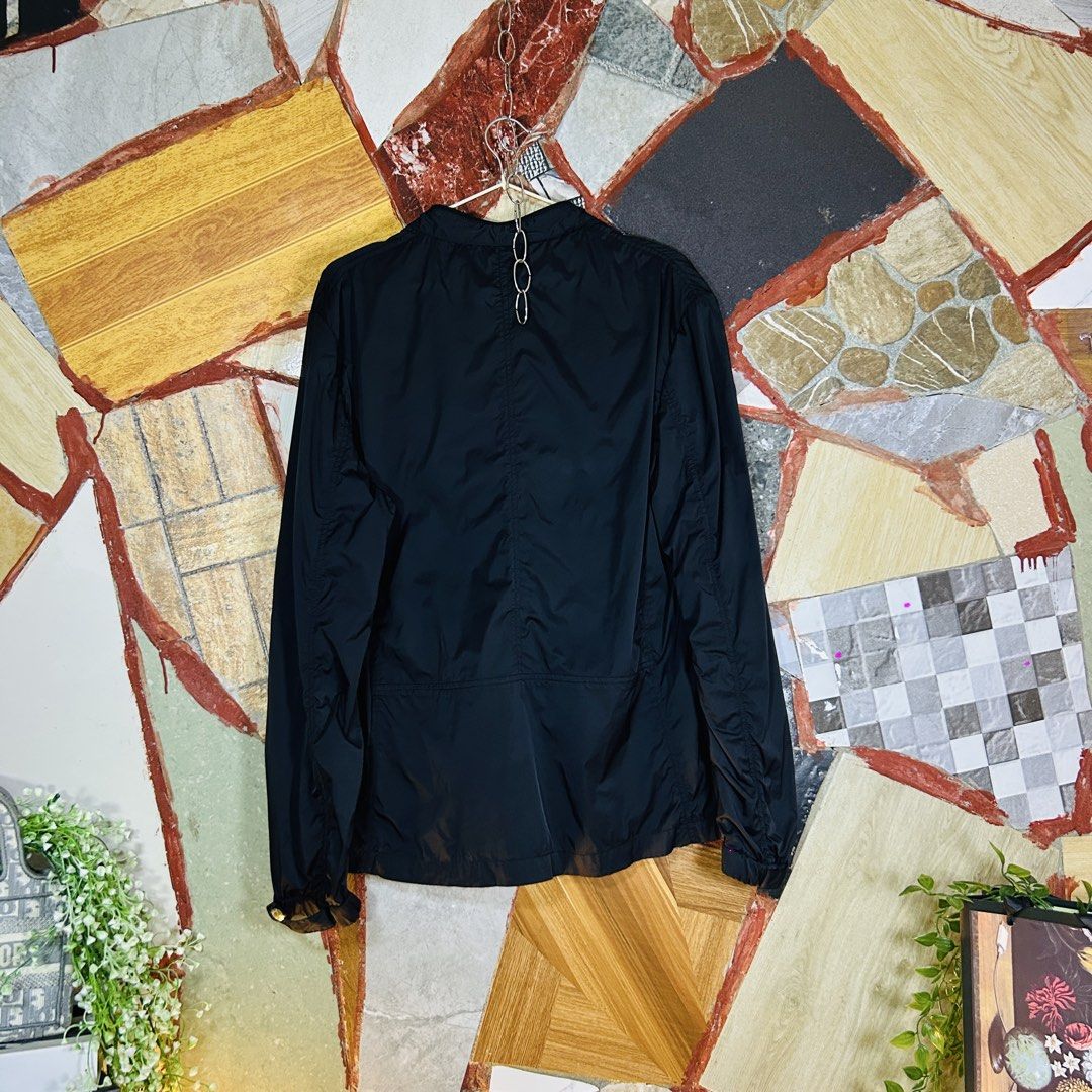 Prada windbreaker lightweight jacket (Category: Luxury Apparel) located in Baguio. Submitted by kckc_luxury (Listing ID 1465108094, Image 3). Description: 🌸 TINY PINK SPOTS ARE LENS DAMAGE, NOT CLOTH STAINS ————————— ❗️KINDLY READ BEFORE MAKING AN OFFER❗️ LISTING DETAILS size:M width x length (inches):21x28 condition: EXCELLENT --- MOP: Gcash / BPI MOD: J&T / JRS LOCATION: Baguio City --- NOTE: • Manage your expectations • Photos did not go unde