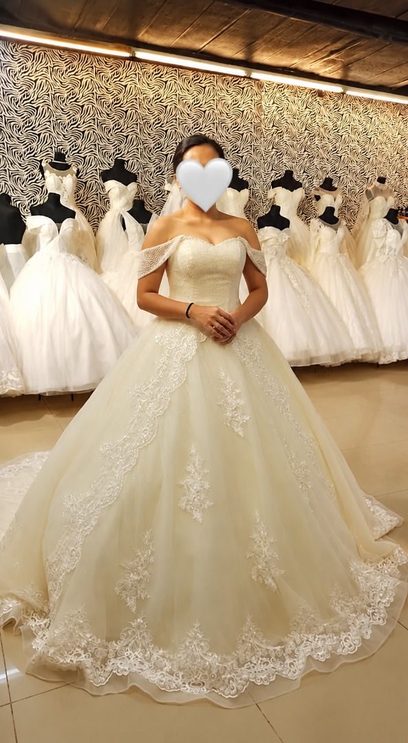 Pre-Loved Ivory Wedding Gown (Category: Evening dresses & gowns) located in Manila. Submitted by marianne2020 (Listing ID 1465087530, Image 2). Description: FOR SALE 🤍 Wedding Gown Elegant ivory wedding gown with beautiful beadwork, lace details, removable off-shoulder sleeves, and a long train. Classic ball-gown style with a timeless bridal look. ✨ Beaded details ✨ Lace accents ✨ Removable off-shoulder sleeves ✨ Long train ✨ Petticoat included 