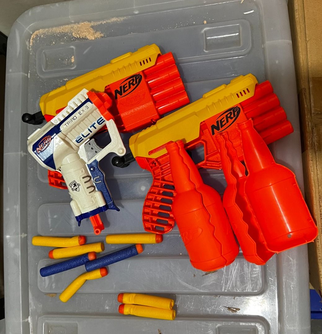 Pre-loved: Nerf Guns (Take all) (Category: Action & Battle Toys) located in Mandaluyong City. Submitted by moonamor (Listing ID 1465025779, Image 1). Description: Set includes 3 nerf guns, two pretend bottle, and 8 foam bullets (some are bent).