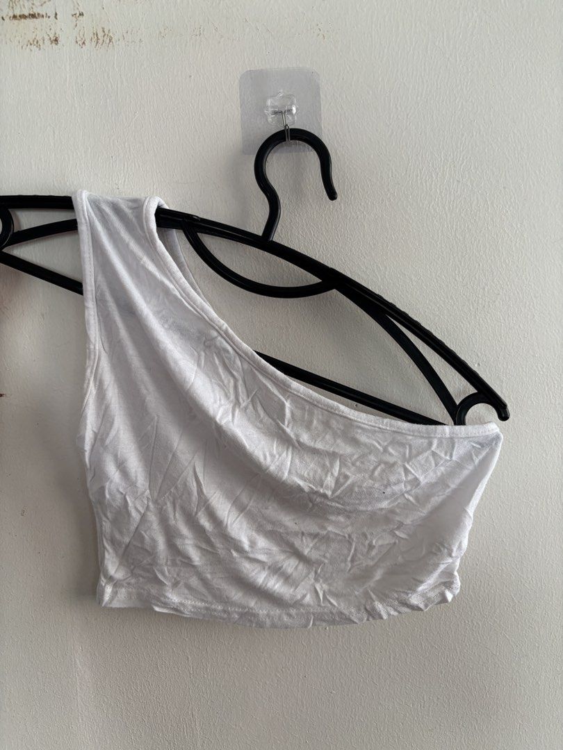 PrettyLittleThing White One-Shoulder Crop Top (Category: Sleeveless) located in Muntinlupa City. Submitted by jc444_ (Listing ID 1465111880, Image 1). Description: - Brand: PrettyLittleThing - Style: One-shoulder crop top - Color: White - Size: UK 6 - Material: Stretchy and comfortable fabric - Condition: Worn a couple of times, plenty of wear left - Perfect for pairing with high-waisted jeans, skirts, or cargo pants.