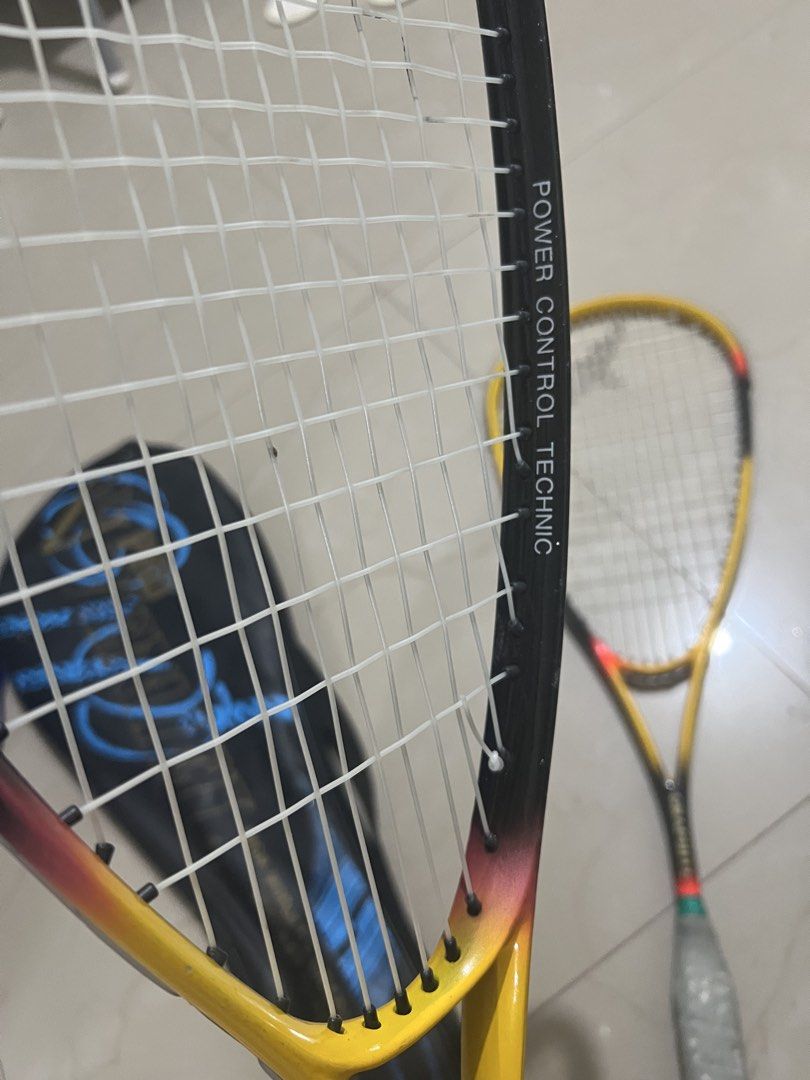 Pro Vencel High-Modulus Graphite Squash Rackets with Cover Set of 2 (Category: Racket and Ball Sports) located in Manila. Submitted by ajdfinds (Listing ID 1465002499, Image 2). Description: - Set of 2 Pro Vencel squash rackets - Material: High-modulus graphite - Design: Yellow, black, and red gradient with Power Control Technic branding - Condition (Frame/Strings): White strings intact, solid overall structure - Condition (Grips): Shows wear and