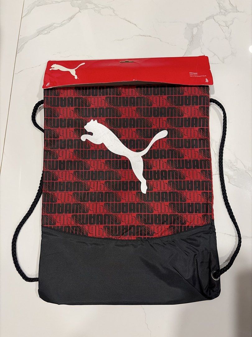 Puma Red and Black Gym Sack Drawstring Bag (Category: Backpacks) located in Manila. Submitted by miguelfits (Listing ID 1465071595, Image 1). Description: - Brand: Puma - Condition: Brand new with original header packaging - Design: Red and black with allover logo pattern and large white leaping cat logo - Features: Heavy-duty black bottom panel and thick black drawstring cords - Ideal for: Gym workouts, sports, or casual everyday carry.