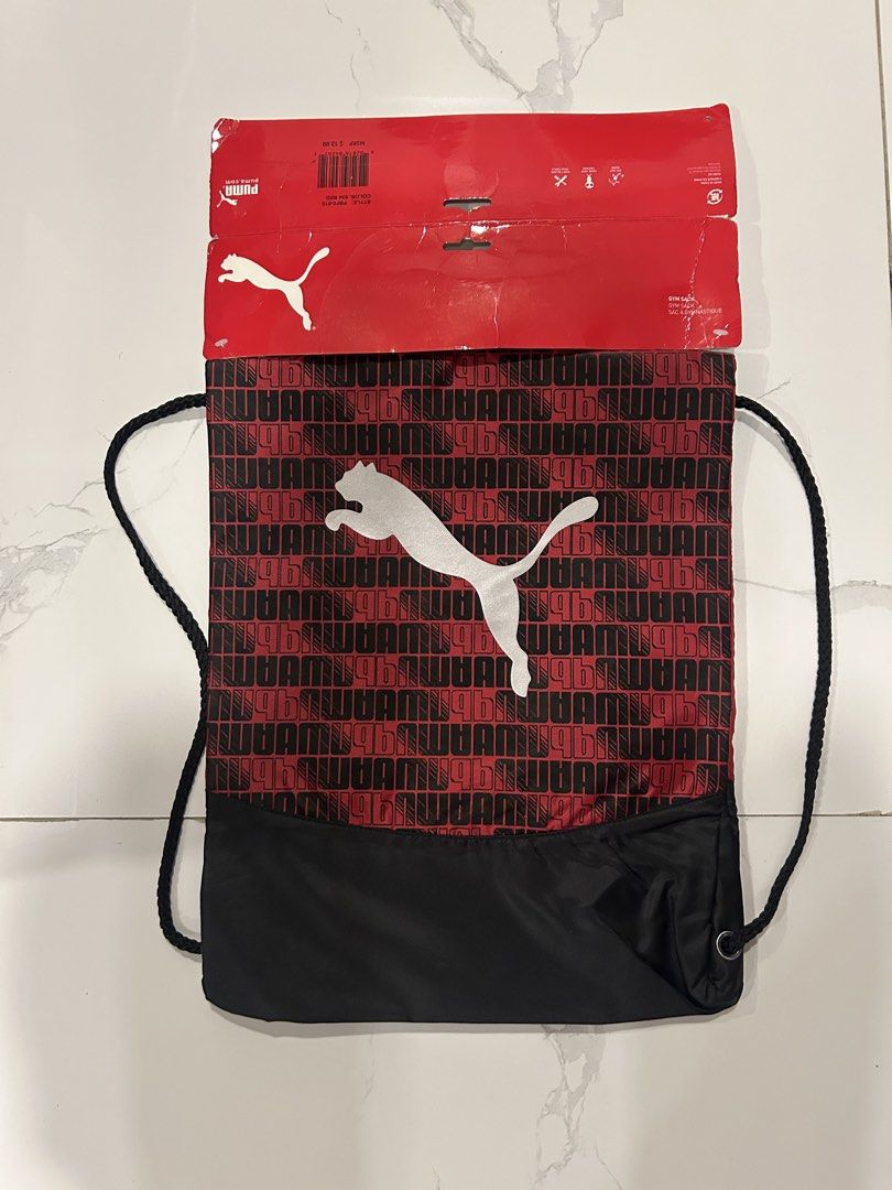 Puma Red Black Gym Sack Drawstring Bag (Category: Sling Bags) located in San Juan City. Submitted by curatedbymae (Listing ID 1465073437, Image 1). Description: Item: Puma Red Black Drawstring Bag - Condition: Brand new with original tag attached, never used - Color: Red and black with a large white Puma cat logo - Design: Repeating Puma wordmark pattern on the upper section and solid red back - Perfect for: Gym, sports, casual outings, or everyd