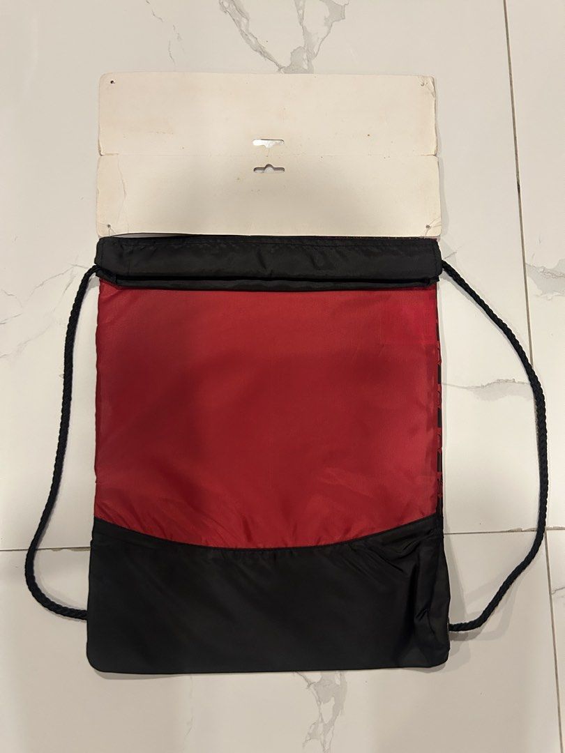 Puma Red Black Gym Sack Drawstring Bag (Category: Sling Bags) located in San Juan City. Submitted by curatedbymae (Listing ID 1465073437, Image 2). Description: Item: Puma Red Black Drawstring Bag - Condition: Brand new with original tag attached, never used - Color: Red and black with a large white Puma cat logo - Design: Repeating Puma wordmark pattern on the upper section and solid red back - Perfect for: Gym, sports, casual outings, or everyd