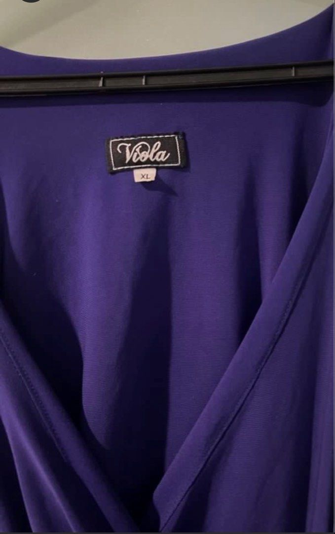 Purple Long Formal Gown - Plus size XL (Category: Dresses) located in Mandaluyong City. Submitted by zimimi12 (Listing ID 1464991516, Image 3). Description: - Brand: Viola - Color: Purple - Size: XL to XXL - Design: V-neckline, sleeveless, with a stylish draped front overlay - Length: Full length, flattering fit - Condition: Worn only once, clean, and ready to wear - Material: Stretchy, comfortable fabric.
