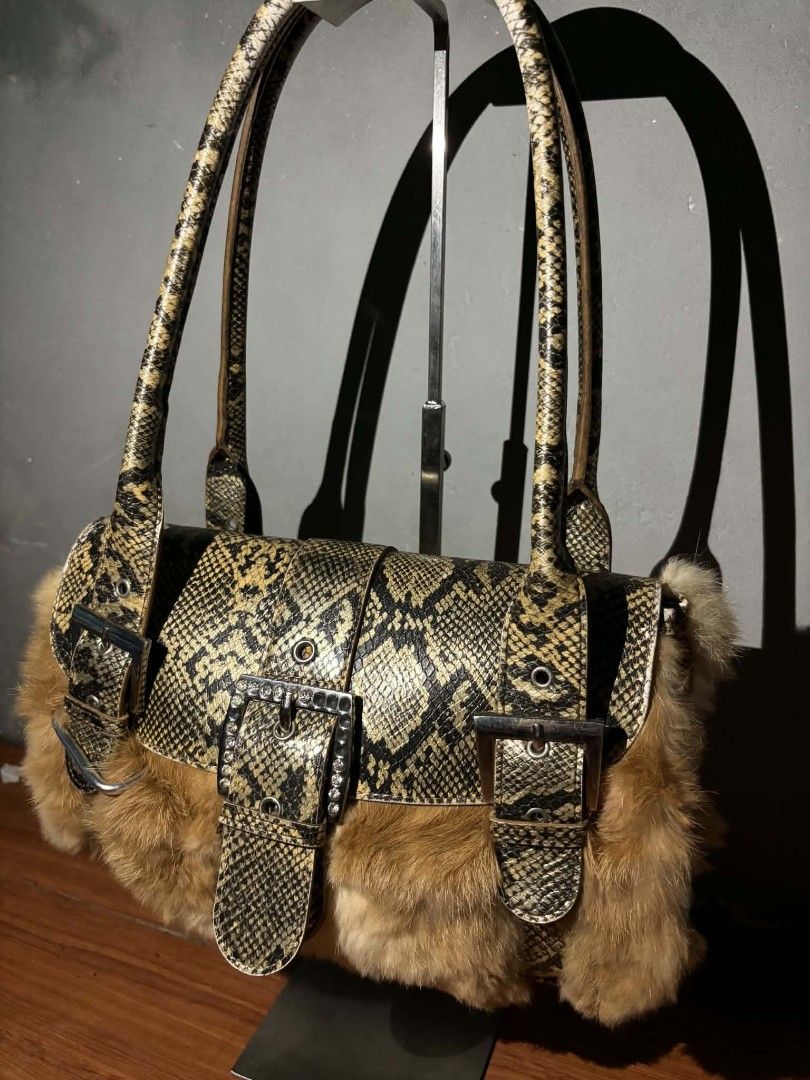 Python skin (Category: Shoulder Bags) located in Manila. Submitted by juicygirl_02 (Listing ID 1465058836, Image 2). Description: Random python snakeskin trim and plush brown fur.