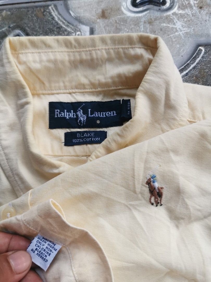 Ralph Lauren Blake Short Sleeve Button Down Shirt Yellow M (Category: Tshirts & Polo Shirts ) located in Davao. Submitted by dmp1993 (Listing ID 1465048721, Image 2). Description: Ralph Lauren Blake short sleeve button-down shirt. Classic yellow colorway in 100% cotton material. Features a button-up front collar and embroidered pony logo on the left chest. Tagged size medium. Made in Hong Kong. Standard fit for casual everyday wear..
