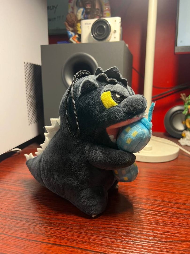 RAre Godzilla Plush Toy (Category: Plushies & Soft Toys) located in Baguio. Submitted by ditoyzb08176 (Listing ID 1465105829, Image 1). Description: - Adorable Godzilla plush toy featuring soft dark grey fabric and classic white dorsal spikes - Detailed with striking yellow eyes and Godzilla biting into a blue building - Includes the original red Godzilla tag attached to the tail - Great addition for collectors or as a gift for monster movie fans