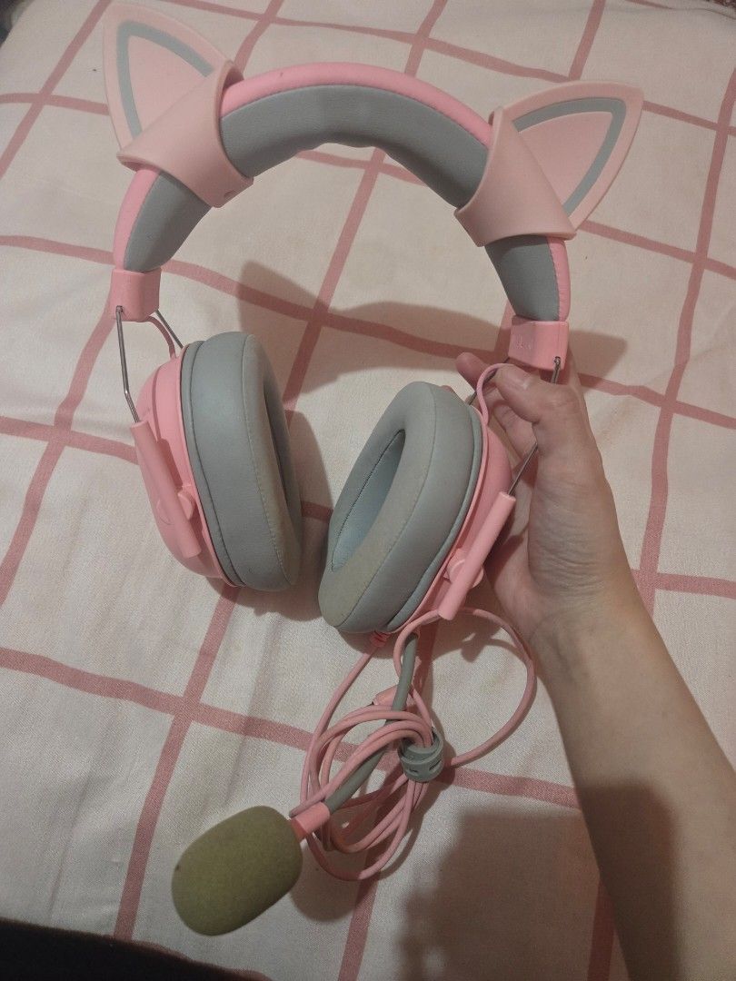 Razer Quartz Pink Gaming Headset with Cat Ears (Category: Headphones & Headsets) located in Manila. Submitted by misushoppa (Listing ID 1465107571, Image 1). Description: Razer Gaming Headset color: pink with separate brand of cat ears condition: 9/10 issue lang yung mismong foam ng microphone since yellowish na, replacable naman siya rfs: hindi na nagagamit, tambak lang sa table. actually di talaga siya nagamit, impulsive buy lang. working, no i
