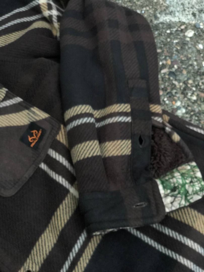 Realtree Fleece Plaid Button-Up Jacket (Category: Coats, Jackets and Outerwear) located in Tacloban City. Submitted by thedropout (Listing ID 1465053110, Image 3). Description: - Brown and black plaid fleece jacket with rugged outdoor style - Warm Sherpa fleece lining for extra cold protection - Realtree camo accents on the inner collar and cuffs - Dual chest pockets with secure button flaps - Classic front button closure - Great layering piece f