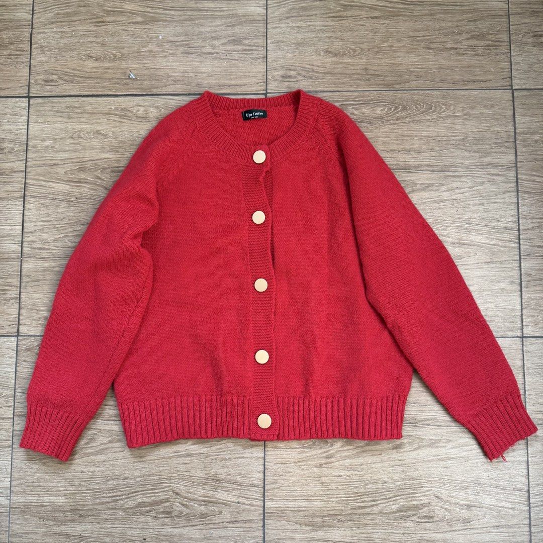 Red Button-Up Knit Cardigan Sweater (Category: Coats, Jackets and Outerwear) located in Cainta. Submitted by nicsboo (Listing ID 1465085279, Image 2). Description: - Color: Bright red - Material: Soft, cozy knit - Details: Large round front buttons, ribbed hem and cuffs - Fit: Comfortable crew neckline, great for layering - Styling: Pairs easily with jeans or skirts.