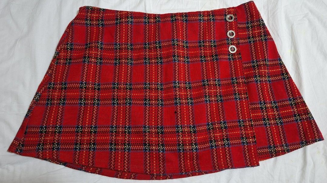 Red Plaid Skort skirt (Category: Skirts) located in Taguig. Submitted by wolffangs (Listing ID 1465012907, Image 1). Description: Red tartan plaid garterized skort with built-in shorts - Material: Thick, textured woven fabric - Waist measures approx. 15.5 inches across (laid flat) see picture with measuring tool.