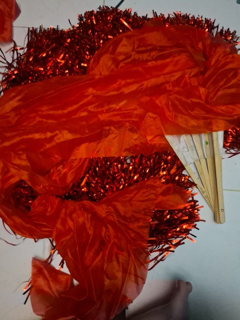 Red pom poms and gradient silk dance fans (Category: Occasions & Party Supplies) located in Manila. Submitted by ogbacsandr04531 (Listing ID 1465099404, Image 3). Description: - Set includes: 7 Sparkly red pom poms (with plastic handles) and 4 long gradient silk dance fans (yellow, orange, red with bamboo frames) - Ideal for: Dance performances, cheerleading, cultural events, and practices - Condition: Stored in decent shape, well-maintained, and