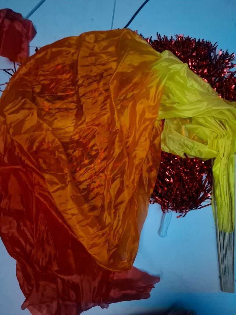 Red pom poms and gradient silk dance fans (Category: Occasions & Party Supplies) located in Manila. Submitted by ogbacsandr04531 (Listing ID 1465099404, Image 2). Description: - Set includes: 7 Sparkly red pom poms (with plastic handles) and 4 long gradient silk dance fans (yellow, orange, red with bamboo frames) - Ideal for: Dance performances, cheerleading, cultural events, and practices - Condition: Stored in decent shape, well-maintained, and
