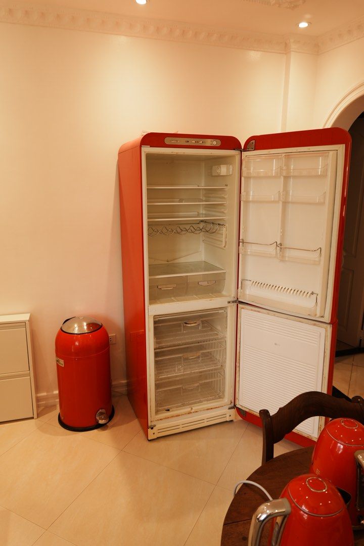 Red SMEF Kitchen Appliance Bundle - Four Pieces (Category: Refrigerators and Freezers) located in Manila. Submitted by heleensym (Listing ID 1464970118, Image 2). Description: A coordinated SMEG collection in vibrant red with chrome-coloured accents and signature 1950s-inspired styling. Includes: • Refrigerator with separate bottom freezer • Two electric kettles • One two-slot toaster All four appliances are confirmed working. Pre-owned, with vis