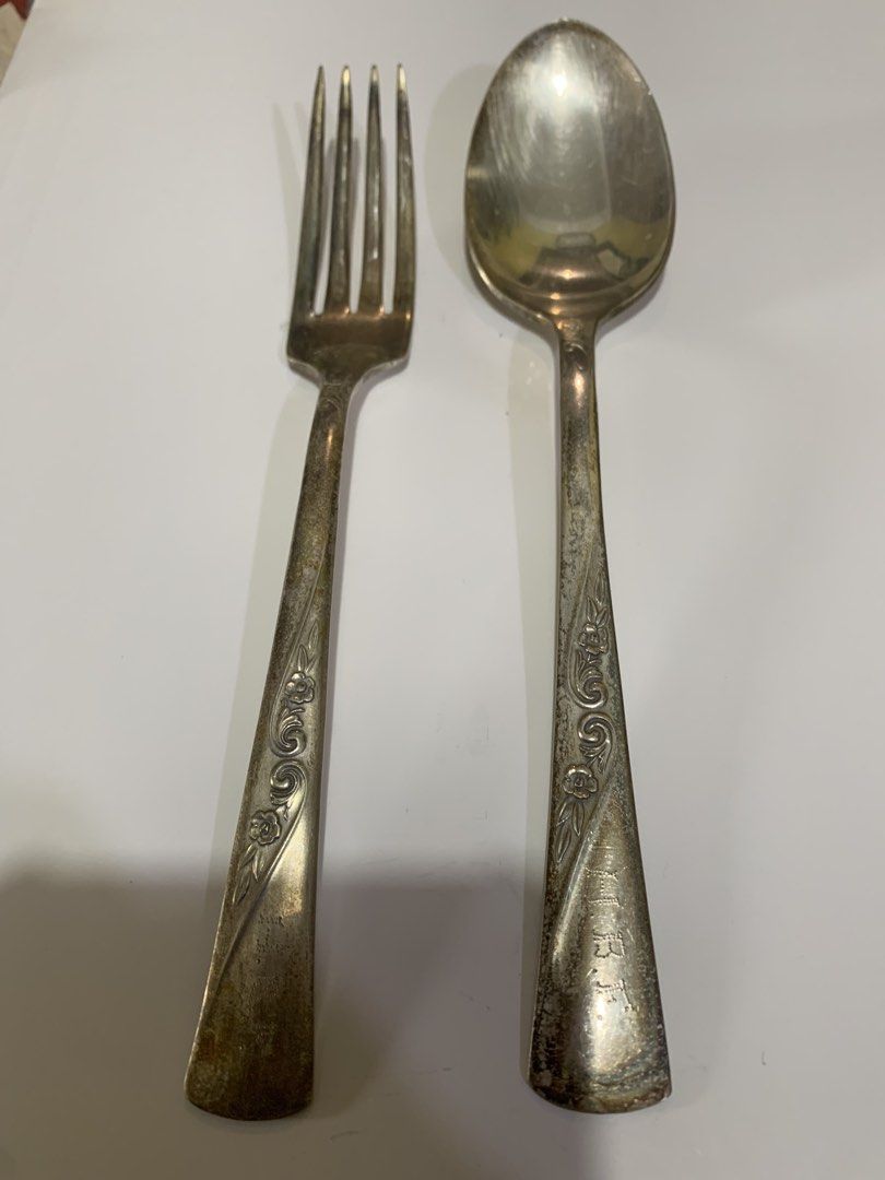 Revelation Silver Plate Fork and Spoon Set (Category: Dinnerware & Cutlery) located in Antipolo. Submitted by cebb888 (Listing ID 1464972283, Image 3). Description: - Vintage 2-piece cutlery set including a fork and spoon - Stamped 'Revelation Silver Plate' on the handles - Features detailed floral and scroll engravings on the lower handles - Shows noticeable tarnish, patina, and discoloration due to age and use - Solid metal silverware ideal for