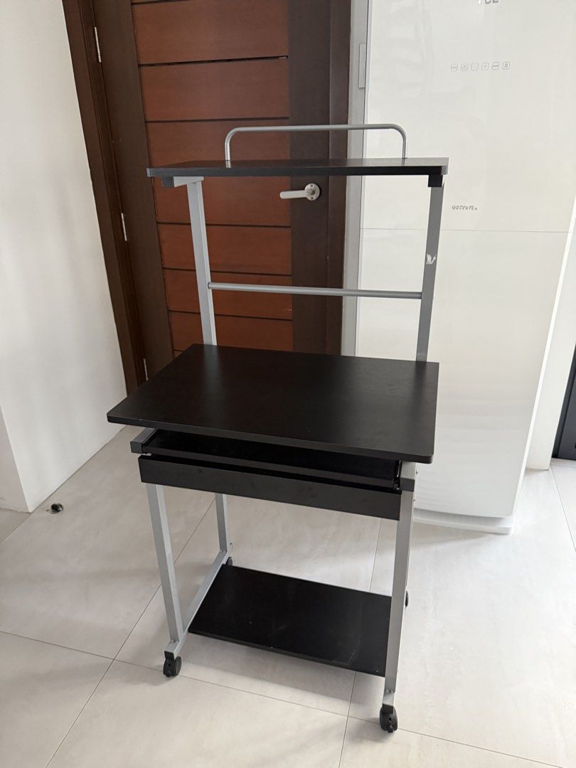 Rolling computer cart with shelves and keyboard tray (Category: Office Furniture & Fixtures) located in Manila. Submitted by queen_k (Listing ID 1465039136, Image 2). Description: Assembled na. Pickup only. No to disassemble Gagamitin nalang. No rust. Good condition - Sleek black and silver rolling computer cart for home offices or study areas - Main desktop fits a laptop or monitor comfortably - Convenient slide-out keyboard tray underneath - To