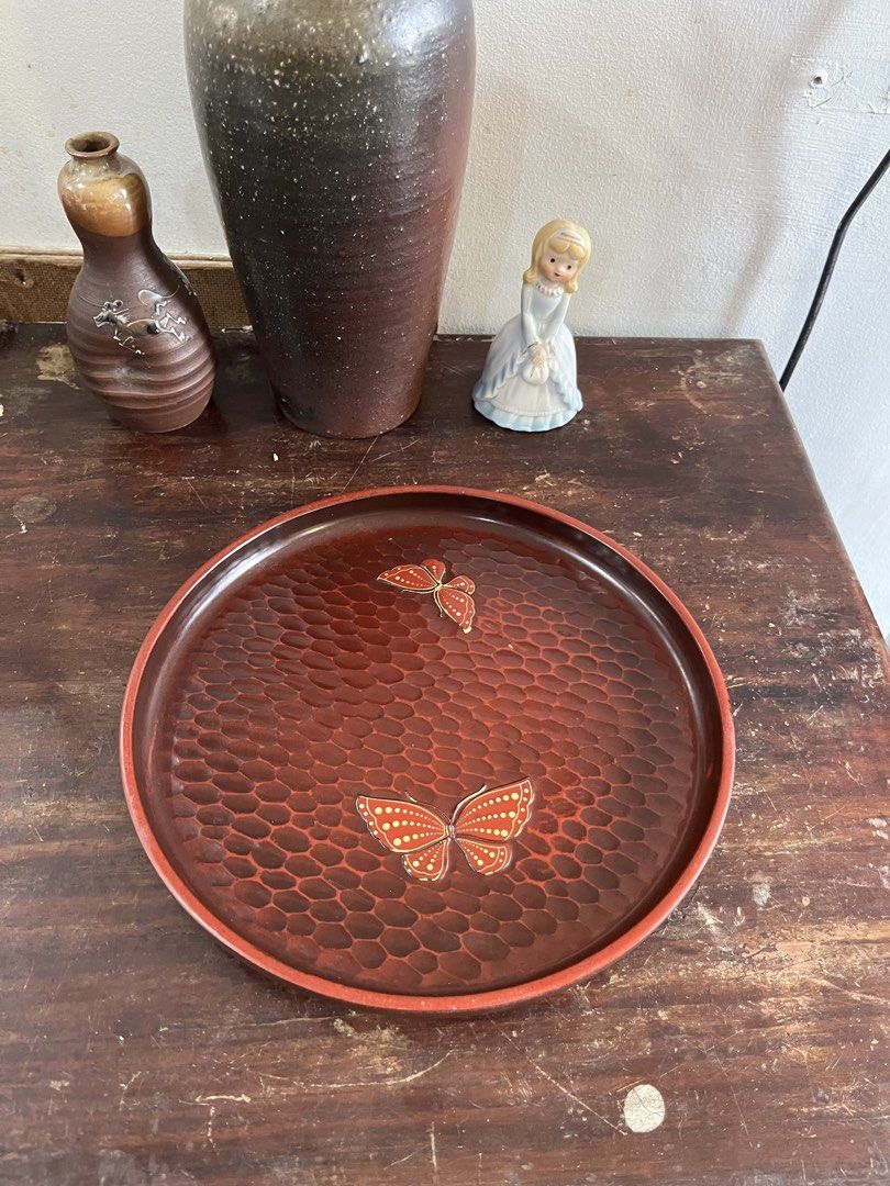 Round Laquer Tray with Butterfly Inlay (Category: Dinnerware & Cutlery) located in Taguig. Submitted by minmin_parker (Listing ID 1465022231, Image 1). Description: - Beautiful round wooden serving tray with a deep reddish-brown finish - Unique hammered texture all over the surface with classic Japanese style - Features two elegant decorative butterflies inlaid with gold dot details - Raised edges keep cups, plates, and glasses secure while carry