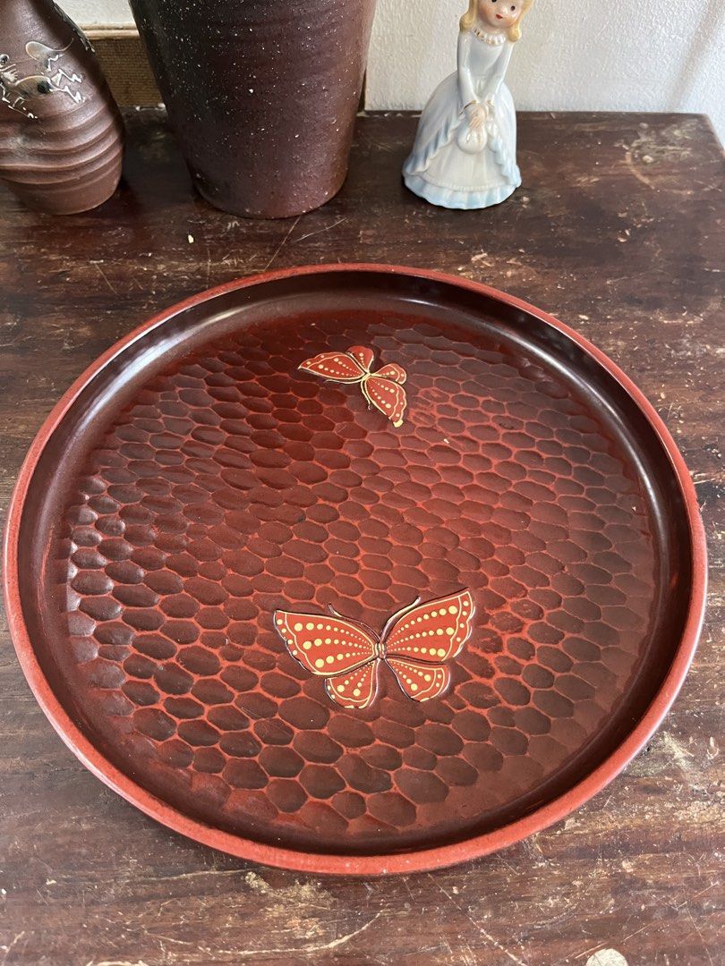 Round Laquer Tray with Butterfly Inlay (Category: Dinnerware & Cutlery) located in Taguig. Submitted by minmin_parker (Listing ID 1465022231, Image 3). Description: - Beautiful round wooden serving tray with a deep reddish-brown finish - Unique hammered texture all over the surface with classic Japanese style - Features two elegant decorative butterflies inlaid with gold dot details - Raised edges keep cups, plates, and glasses secure while carry