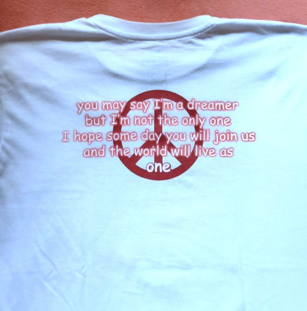 Round- neck white shirt (Category: Tshirts & Polo Shirts ) located in Manila. Submitted by declutter.mnla (Listing ID 1465027158, Image 2). Description: white cotton fabric shirt, a not so big XL, w/ John Lennon picture in front and short lyrics of his song at the back.. Nice material of fabric..