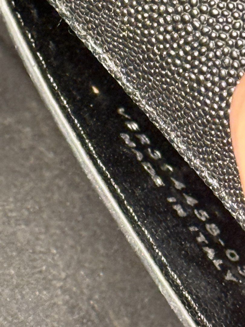 Saint Laurent YSL Monogram Black Grained Leather Chain Bag (Category: Luxury Bags & Wallets) located in Manila. Submitted by zuji.ph (Listing ID 1464994877, Image 2). Description: -Saint Laurent bag in classic black grained leather - Features signature gold-tone YSL logo hardware and matching chain strap with branded plaque - Structured silhouette with a secure foldover closure - Clean interior compartment with visible serial number stamping - Ve