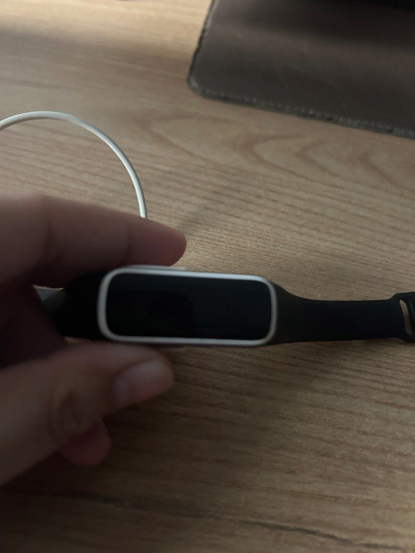 SAMSUNG (Category: Wearables & Smart Watches) located in Cabiao. Submitted by ninaaaaaaahhh (Listing ID 1465058640, Image 3). Description: - Authentic Samsung fitness tracker band - Stylish black design with silver casing accent - Lightweight and comfortable for daily wear or workouts - Includes original charging dock and USB cable.