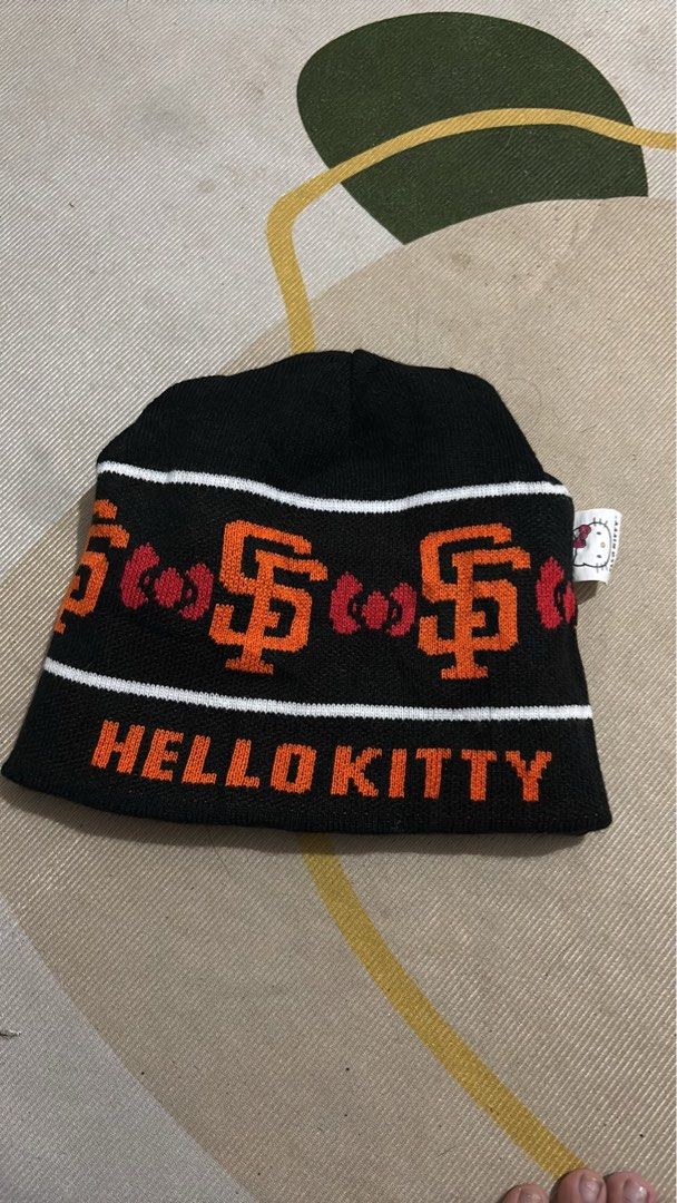 San Francisco Giants Hello Kitty Beanie Hat (Category: Hats & Beanies) located in Manila. Submitted by glano (Listing ID 1465011071, Image 2). Description: - Official San Francisco Giants x Kitty collaboration beanie - Reversible design: Orange side with Kitty graphic; Black side with repeating SF logos, red bows, and text - Colorway: Black, white, and orange - Perfect crossover piece for MLB fans and Sanrio collectors.