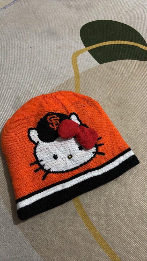 San Francisco Giants Hello Kitty Beanie Hat (Category: Hats & Beanies) located in Manila. Submitted by glano (Listing ID 1465011071, Image 1). Description: - Official San Francisco Giants x Kitty collaboration beanie - Reversible design: Orange side with Kitty graphic; Black side with repeating SF logos, red bows, and text - Colorway: Black, white, and orange - Perfect crossover piece for MLB fans and Sanrio collectors.