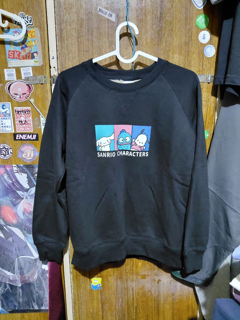 Sanrio Characters Black Fleece Sweatshirt (Category: Coats, Jackets and Outerwear) located in Imus. Submitted by frootiloots4103 (Listing ID 1464985216, Image 1). Description: - Design: Cute Sanrio graphic print featuring Pochacco, Keroppi, and Cinnamoroll - Color: Black - Size: Medium (M) - Lining: Warm and cozy white sherpa fleece interior - Style: Crew neck pullover with ribbed cuffs and hem - Condition: Great for casual, everyday wear OPEN FO