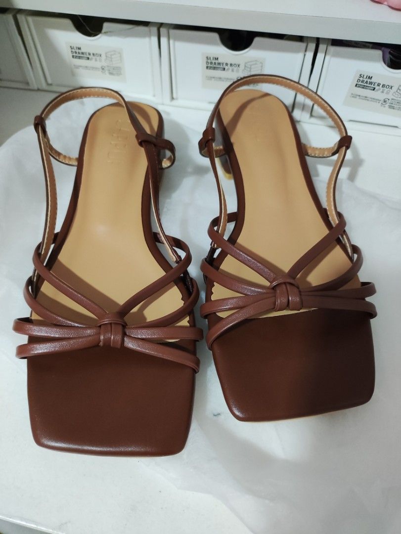 SAPPUN kimer strap flat sandals (Category: Heels) located in Manila. Submitted by anniemazing (Listing ID 1465102989, Image 3). Description: SAPPUN sandals bought from Korea (2cm) Style: Square toe with delicate knotted front straps and ankle slingback Color: Brown Size: 38 (240mm) (US7) Heel: Low block heel for all-day comfort Inclusions: Extra heel grip pads included + selling coz mejo tight sa feet ng daughter ko, she has slightly wide feet + 