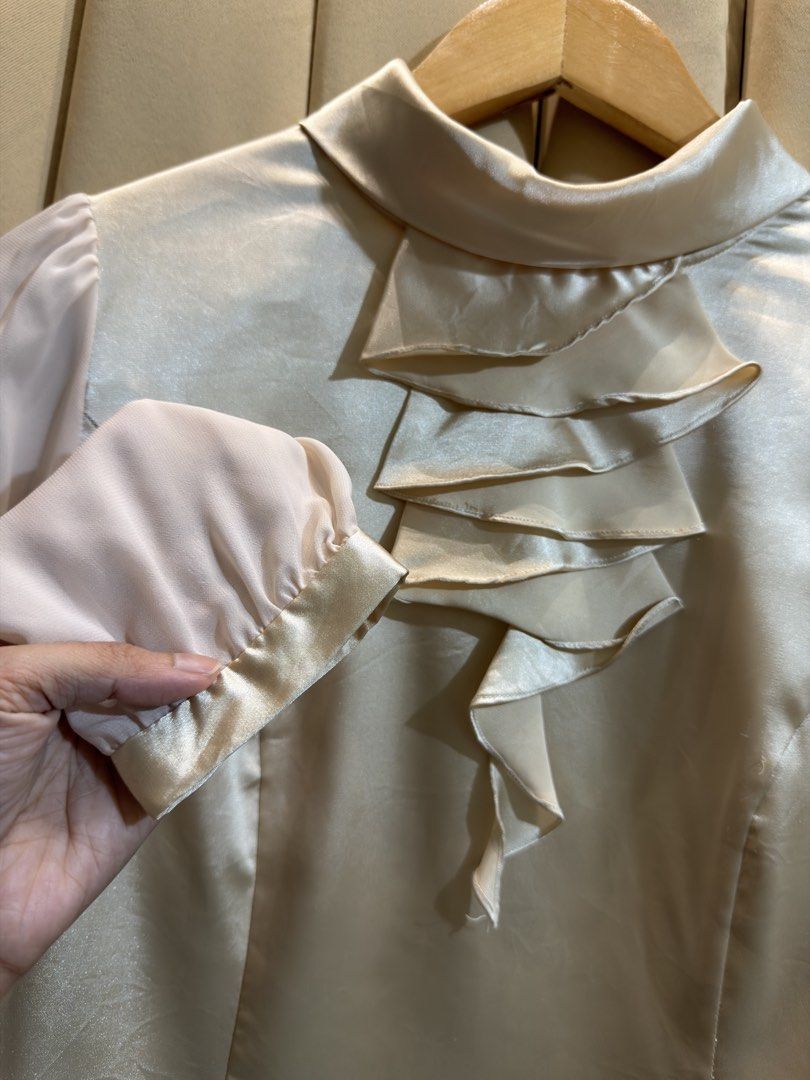Satin Close Neck Blouse (Category: Longsleeves) located in Manila. Submitted by glamstylemnl (Listing ID 1465145697, Image 2). Description: ♡ SIZE: M ♡ BUST: 36 ♡ Swipe left to see the actual color & details ♡ tiered front ruffle / sheer long sleeves ♡ HQ • 10/10 ♡ Ready to wear 👚.