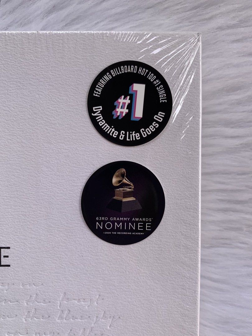 Sealed BTS BE Essential Album (Category: CDs & DVDs) located in Oslob. Submitted by myghaulz (Listing ID 1464972086, Image 2). Description: Official BTS BE Album, brand new and sealed in its original plastic wrap. Features the rare Billboard Hot 100 number one and 63rd Grammy Awards nominee stickers on the white embossed cover. A must-have for any K-pop collector!.