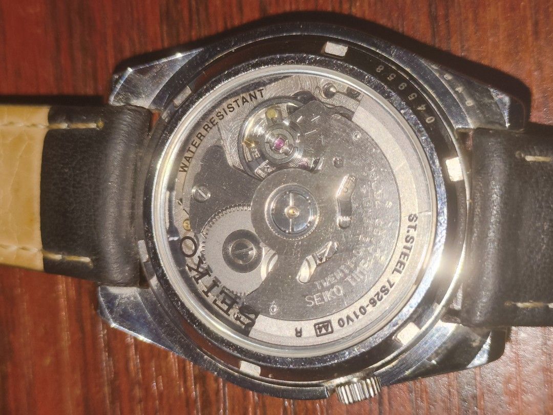 Seiko SNKL45 for sale (Category: Men's Watches) located in Manila. Submitted by bryan101 (Listing ID 1465169177, Image 2). Description: - Brand: Seiko 5 Automatic Watch no box - Dial: Black sunburst dial with a vibrant red second hand - Features: Day and date window conveniently located at 3 o'clock - Strap 1: Currently paired with a classic black leather strap - Extras: Original stainless steel bracelet with plastic wrapping.