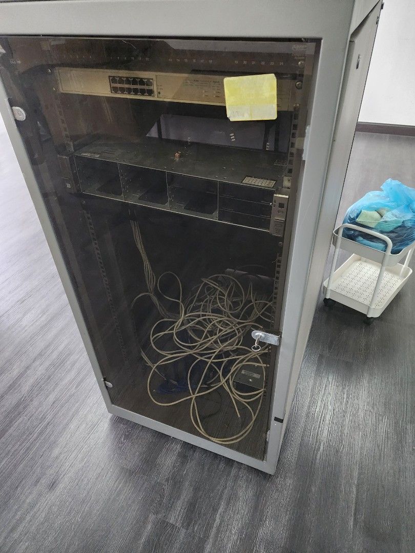 Server Rack and Server (Category: Office & Business Technology) located in Petaling Jaya. Submitted by zeekorino (Listing ID 1465129876, Image 1). Description: - Large grey server rack with secure glass front door and lock - Heavy-duty metal frame construction for maximum durability - Dimensions: Large capacity server cabinet - Condition: Used, office clearance - Self-pick up only due to extreme size and weight (bring help/transport) Price negoti