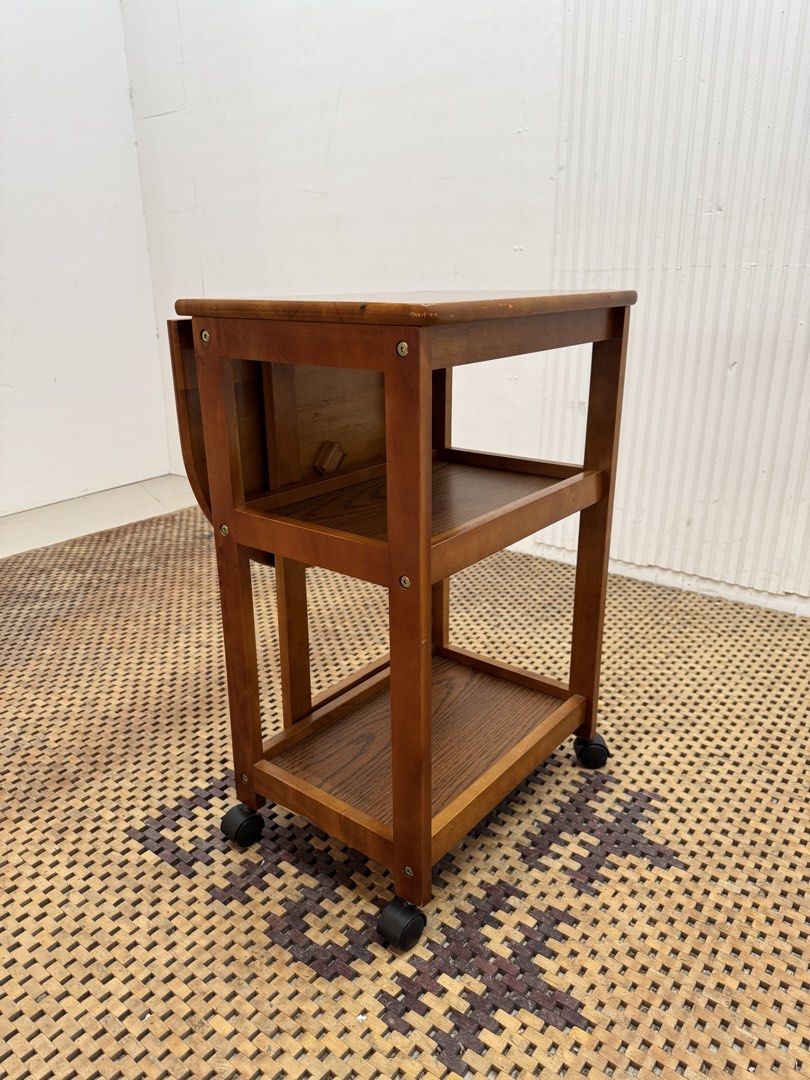 Serving cart (Category: Tables & Sets) located in Quezon City. Submitted by matetdevis13 (Listing ID 1464971349, Image 3). Description: Wooden Drop-Leaf Serving Cart Price: 3,900 L27/13.5 x W17.5 x H27 In good condition Code JMD18-MJ563.