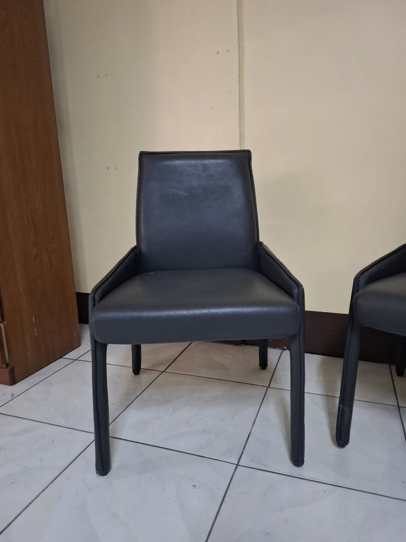 Set of 2 Black Leather Dining Chairs (Category: Chairs) located in Quezon City. Submitted by dannikkishoppe2 (Listing ID 1464974611, Image 3). Description: Set of 2 Black Leather Dining Chairs ‼️₱4800‼️ • Clean, modern look with structured armrests and sturdy legs • Supportive backrest, ideal for dining tables or office desks • Shows minor signs of wear, but overall structurally solid Please manage your expectations as there might be minimal flaw