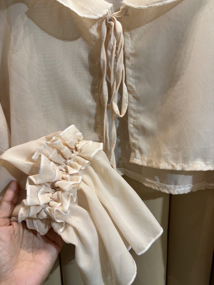 Sheer Chiffon Cardigan (Category: Longsleeves) located in Manila. Submitted by glamstylemnl (Listing ID 1465145377, Image 2). Description: ♡ SIZE: fit up to XL ♡ BUST: 44 ♡ Swipe left to see the actual color & details ♡ ruffled collar / tie-front closure / ruffled cuffs ♡ HQ • 10/10 ♡ Ready to wear 👚.