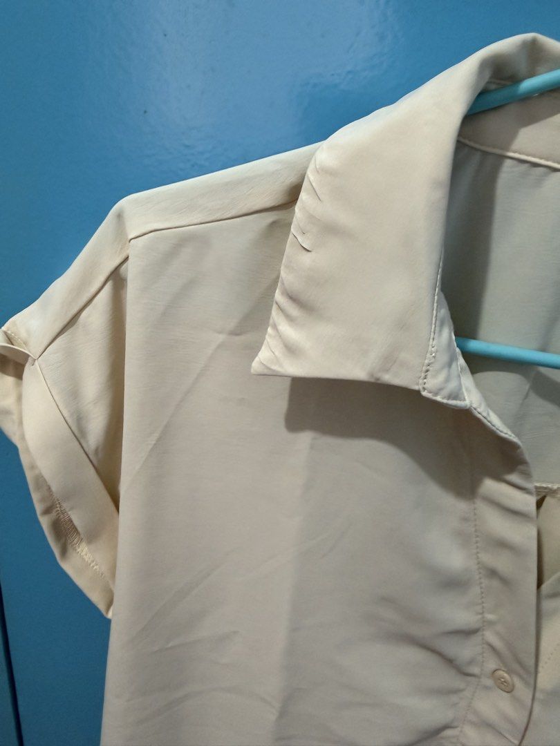 SHEIN Beige Short Sleeve Button Down Blouse Size M (Category: Blouses) located in Bacoor. Submitted by celia1627 (Listing ID 1464969235, Image 3). Description: - Brand: SHEIN - Size: Medium (EU 38, US 6) - Color: Versatile beige (goes with everything!) - Style: Short rolled-up sleeves, collar neck, front button closure - Fabric: Lightweight and comfortable - Condition: Great for work, casual outings, or smart-casual looks.
