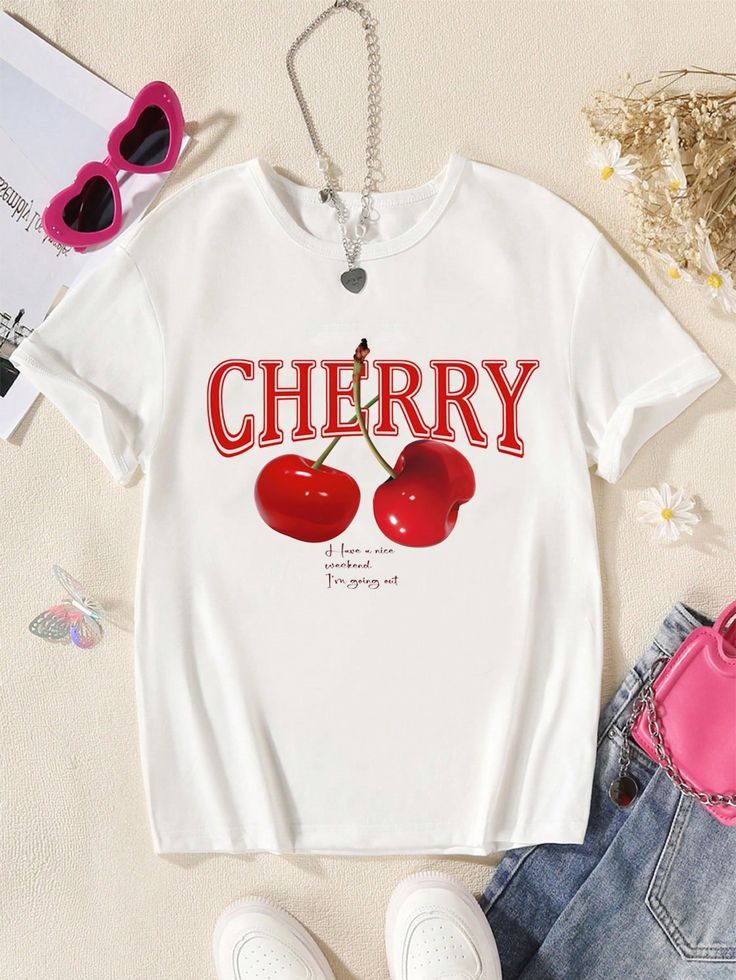 Shein Cherry Graphic White T-shirt (Category: Shirts) located in Manila. Submitted by dianafayesimbre (Listing ID 1465072291, Image 1). Description: White short-sleeve tee from Shein. Red cherry graphic print on the front with text lettering. Round neckline. Size 12Y tag on tag but can fit xs to semi medium womens. Plain solid white back. Lightweight fabric, easy to style with jeans or skirts..