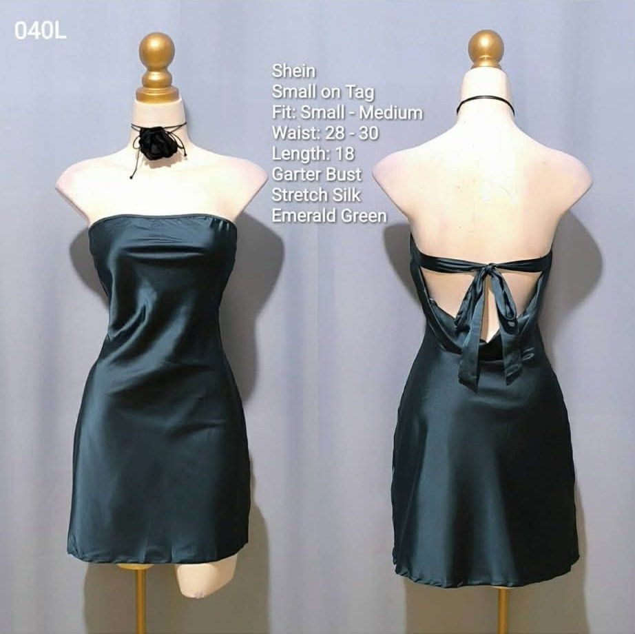 Shein Emerald Green Stretch Silk Mini Dress Small Medium (Category: Dresses) located in Imus. Submitted by anggeshop (Listing ID 1465049728, Image 1). Description: - Brand: Shein - Color: Emerald Green - Size: Small on tag (fits Small to Medium comfortably) - Material: Stretch silk fabric with smooth finish and garter bust - Measurements: Waist 28-30 inches, Length 18 inches - Design: Open back with tie-back strap closure - Condition: Clean and e